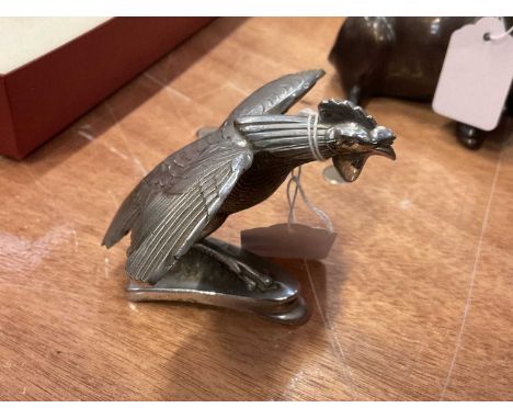 Vintage Singer Bantam car mascot in the form of a flying hen.