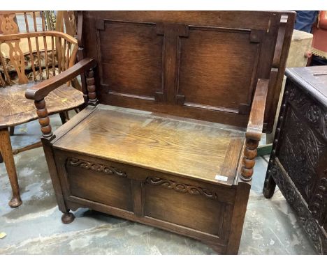 Oak monks bench with folding top, rising seat and panelled blanket box base with bobbin turned supports 91cm wideGood conditi