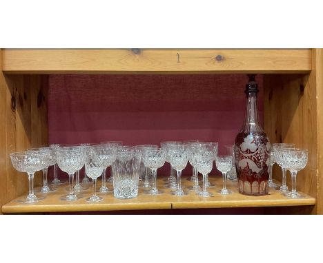 Service of cut glass and a ruby flash glass decanter with stopperStopper of decanter chipped. The glasses all good apart from
