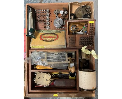 Collection of watchmakers tools and accessories, and an empty cabinet