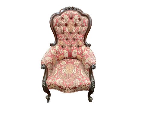 Victorian mahogany framed button back armchair, raised on castors