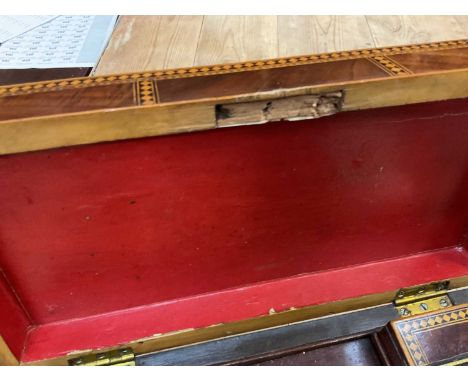 Regency mahogany and inlaid tea caddy, together with a carved alabaster Cupid figure and an antique jelly mould