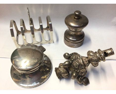 Group of silver items to include a silver toast rack, silver inkwell, silver pepper grinder and a Victorian white metal child