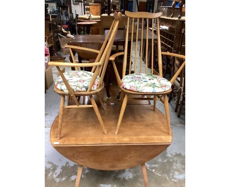 Ercol drop leaf table, 114cm x 124cm, together with a set of four chairs comprising two carvers and two standards