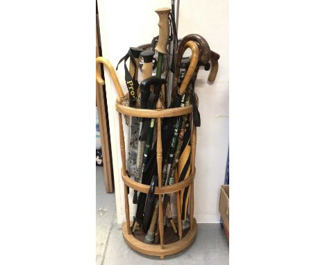 Wooden stick stand with various walking sticks etc