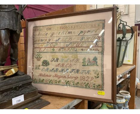 George IV needlework sampler by Helena Regenburg, dated 1829, mounted in glazed frame.