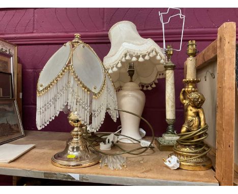 Pair of brass lamps, a ceramic lamp and two others (5).