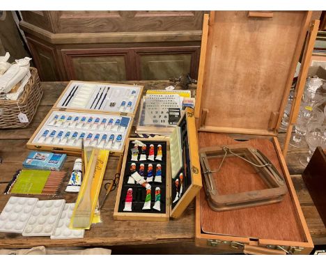 Group of artist's supplies, including a travelling easel, paints, etc