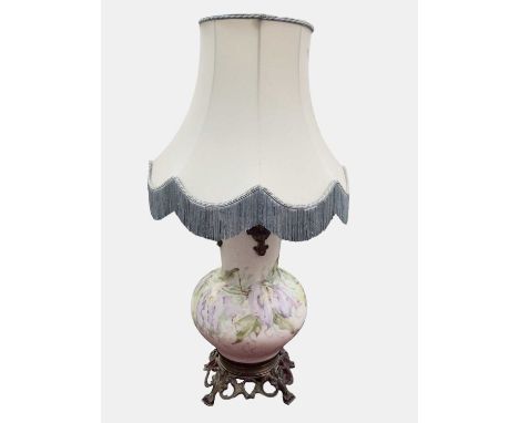 Decorative early 20th century Continental porcelain and metal lamp, of large bulbous form decorated with floral design, on pi