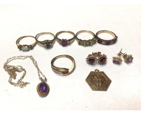 18ct gold ruby cross-over ring, five 9ct gold gem set dress rings, 9ct gold St. Christopher pendant, amethyst pendant on 9ct 