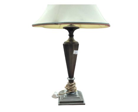 Bronzed metal lamp with tapered faceted column on sqaure stepped base, with shade