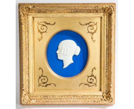 EARLY 19TH CENTURY WHITE BISQUE PORCELAIN PORTRAIT MINIATURE
a very fine Regency portrait relief of a women, on a bright blue