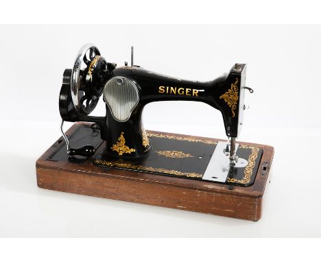 EARLY 20TH CENTURY SINGER SEWING MACHINE
with hand-crank handle, with black enamel with gilt detailing, serial number 'EH9963