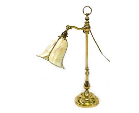 A modern brass effect table lamp, with Tiffany style flower head yellow / cream shade, column support with loop finial and ci