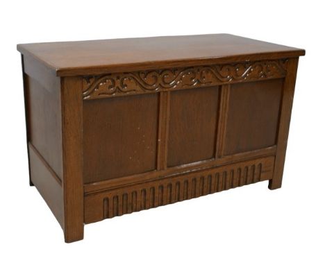 A vintage stained oak blanket chest, lift lid, carved decoration, 94 by 47 by 56cm high. 