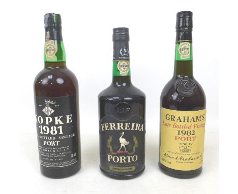 Three bottles of vintage port, including a Kopke 1981, Ferreira Porto, and Graham's 1982. (3) 
