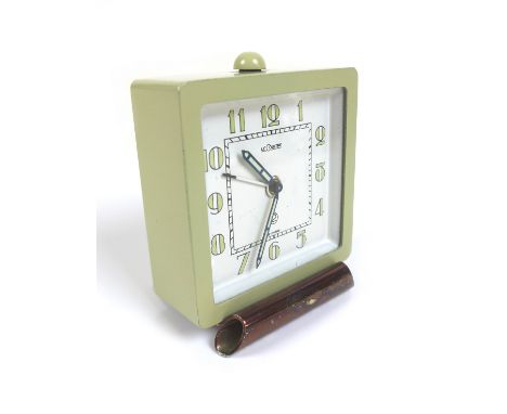 A retro Jaeger LeCoultre alarm clock, with pale blue metal case, Arabic dial, 5.5 by 3.5 by 6.5cm high, and a fitted case. 