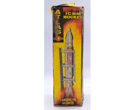 Louis Marx, Rare Vintage boxed, ICBM Rocket with launch pad and gantry. This version features a yellow plastic rocket, a blue
