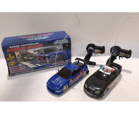 Mega Motors, a boxed 1:15 Scale RC Police Chase. Although unchecked for completeness or if in working order condition appears