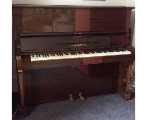 Bechstein (c1966)A Model 8 upright piano in a bright mahogany case. This instrument is sold with an Article 10 Certificate du