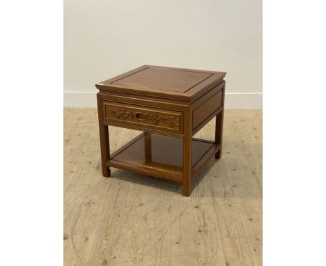 A Chinese hardwood lamp table, the panelled top over single drawer, raised on square supports united by an under tier H57cm, 