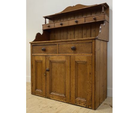 A Victorian pine dresser, the open shelf over four spice drawers, above two drawers and three doors to base, (old wood worm) 