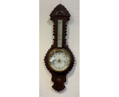 A Victorian oak cased banjo pattern aneroid barometer and thermometer, with white ceramic registers H90cm