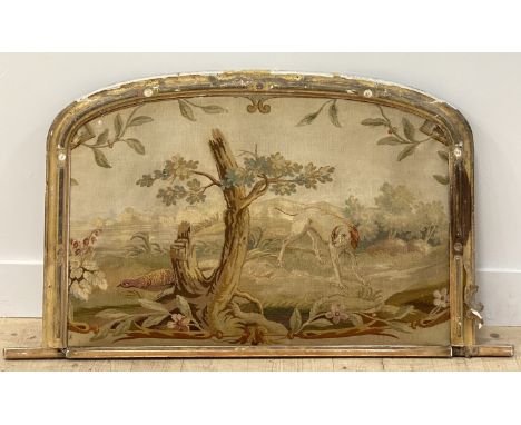 A French 19th century hand embroidered tapestry depicting a dog and grouse within a natural vista, mounted on a Victorian gil