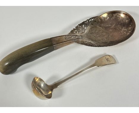 A Eastern white metal serving spoon with pierced dragon and engraved lotus flower design and shaped horn handle, ( L x 28cm) 