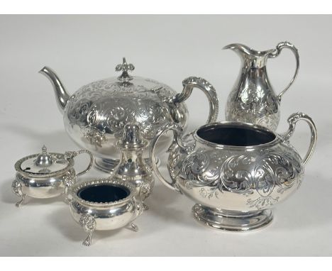 A Edwardian style three piece circular Epns tea set comprising tea pot, two handled sugar basin and milk ewer all with scroll