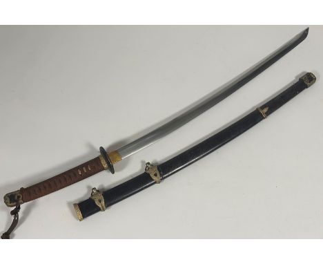 A Japanese samurai sword, bound handle with brass fittings and tsuba, plain polished steel blade (68cm), fish skin covered sc