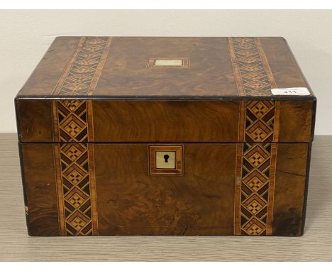 A Victorian walnut work box, the exterior with Tumbridge ware and mother of pearl inlay, opening to a silk lined and well fit
