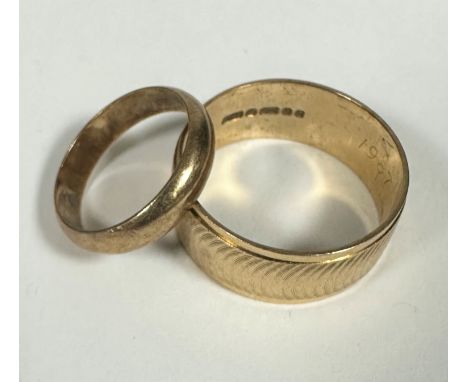 A 9ct gold plain wedding band, L and a 9ct gold gents engine turned engraved wedding band, X. 8.5g