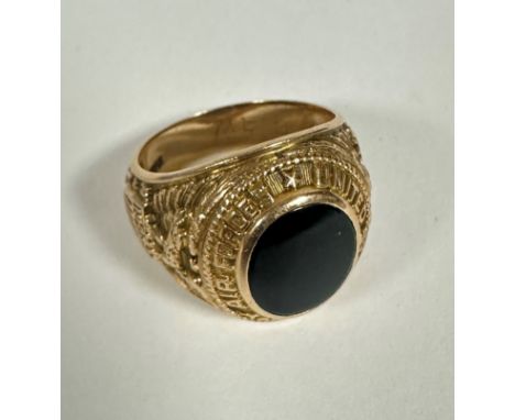 A 10k gold American Army Air Forces Class style ring set oval onyx to top, enclosed in rub over setting and Golden eagle to e