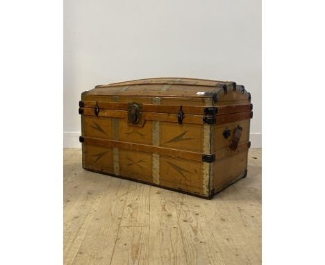 A late 19th century wood and metal bound dome top trunk, decorated with tooled leather, L94cm