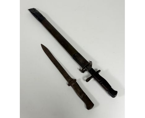 A 1917 US Remington bayonet in green leather scabbard (a/f), together with a Mauser M188/98 knife bayonet (no scabbard and wo