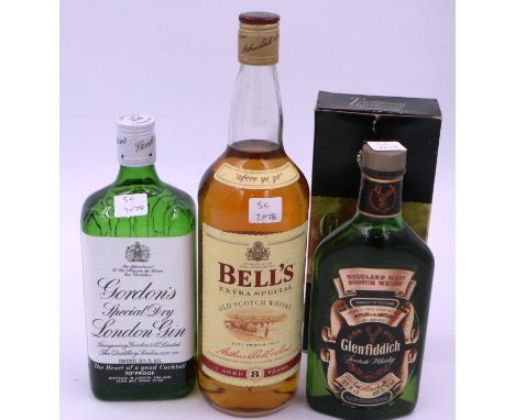Bottles of Bells, Glenfiddich whisky and a bottle of Gordons special Dry London gin. Not available for in-house P&amp;P 