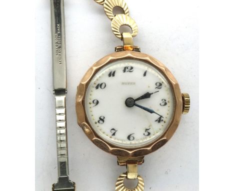 Buren: 9ct gold fifteen jewel ladies wristwatch on a rolled gold bracelet, working at lotting. P&amp;P Group 1 (£14+VAT for t