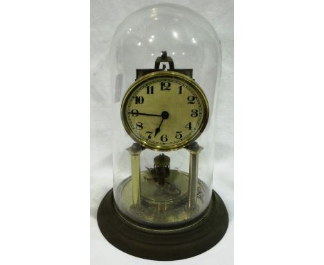 Brass anniversary clock with key in a glass dome, H: 33 cm. P&P Group 3 (£25+VAT for the first lot and £5+VAT for subsequent 