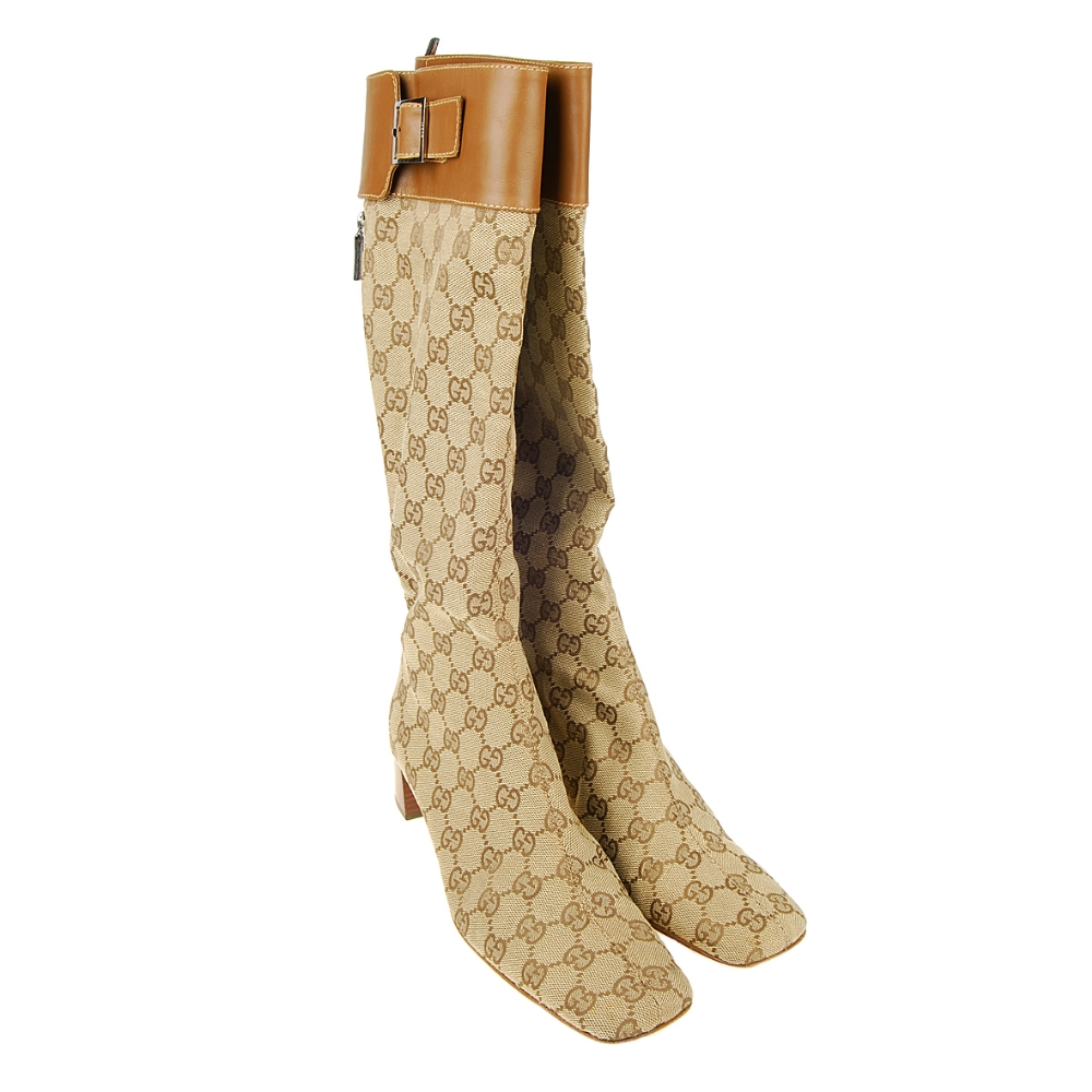 GUCCI - a pair of GG Monogram knee-high boots. Designed with maker's ...