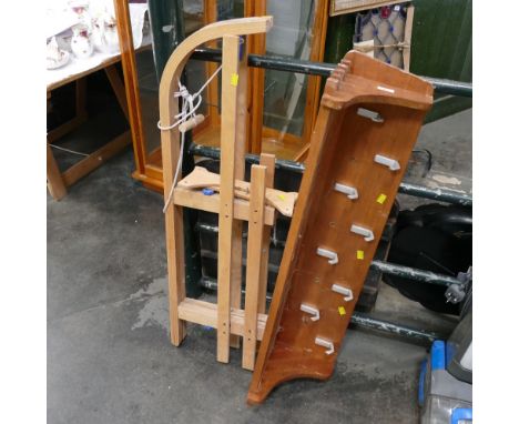 Folding sledge and shelved coat rack