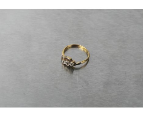 18 ct gold three stone diamond crossover ring, size M, weight 1.9 grams