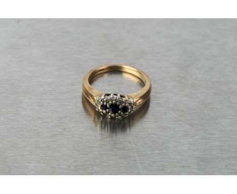9 ct gold diamond and sapphire ring, size M/N, weight 3.7 grams