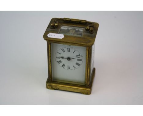French 19th century brass case carriage clock with white enamel dial complete with key.