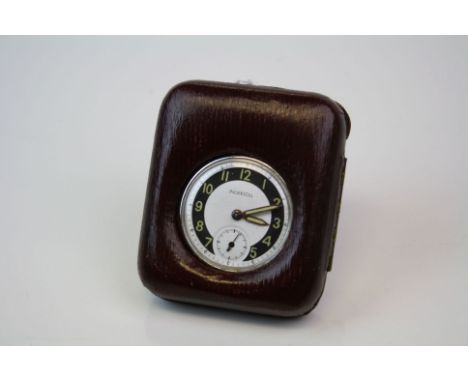 Ingersoll top winding pocket watch within easel backed travel case.