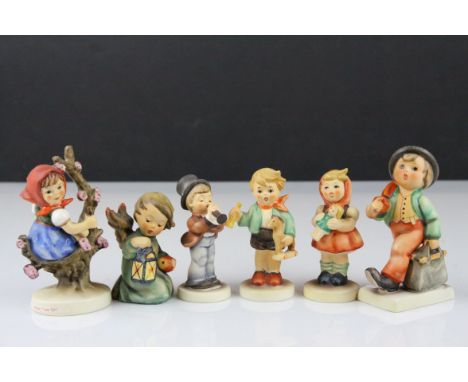 Six Goebel Hummel Figures including Merry Wanderer, Apple Tree Girl, Serenade, Girl with Doll, Boy with Horse and Guiding Ang