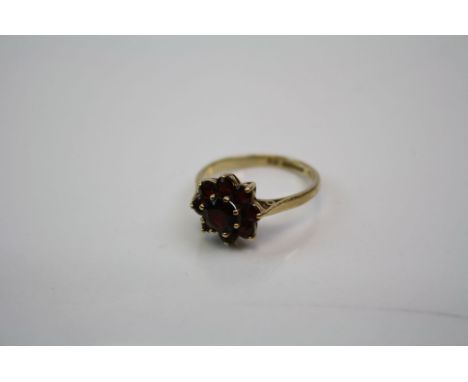 A Fully hallmarked 9ct gold and garnet ladies ring.