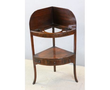 George III Mahogany Bow Fronted Corner Washstand, the under-tier shelf fitted with three drawers, 98cms high