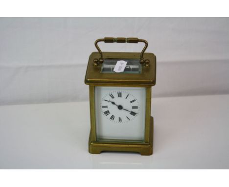 Antique French made brass cased carriage clock with white enamel dial complete with key.