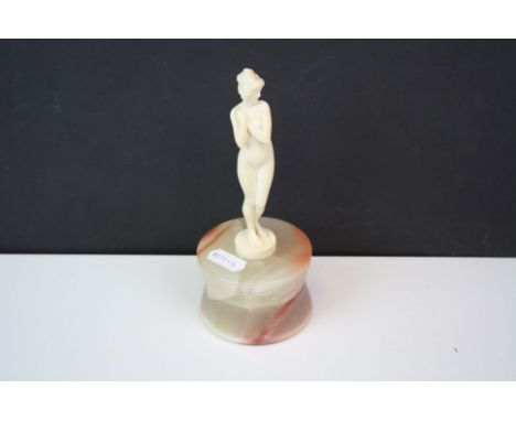 Art Deco ivory nude figurine on a polished onyx base.